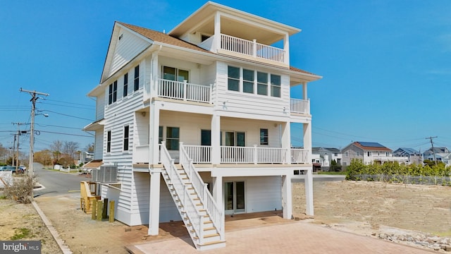 29 Bay Way, Brick, NJ 08723 - raised beach house featuring decorative driveway, roof with shingles, stairway, and a balcony