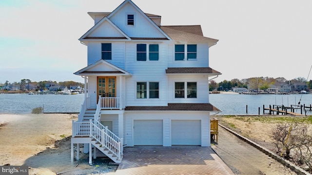 29 Bay Way, Brick, NJ 08723 - coastal home featuring stairs, a water view, a shingled roof, and a garage