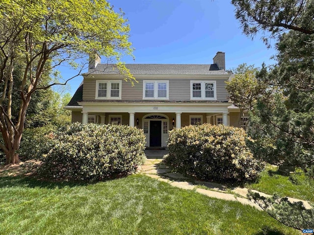 1012 Locust Ave, Charlottesville, VA 22901 - view of front facade featuring a front lawn, a chimney, and covered porch