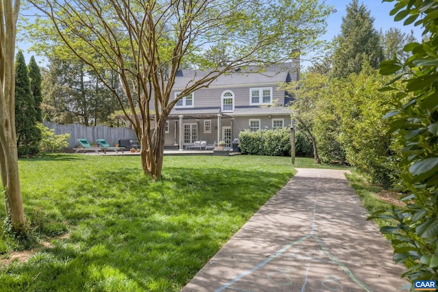 1012 Locust Ave, Charlottesville, VA 22901 - rear view of house featuring a lawn, fence, a patio area, and french doors