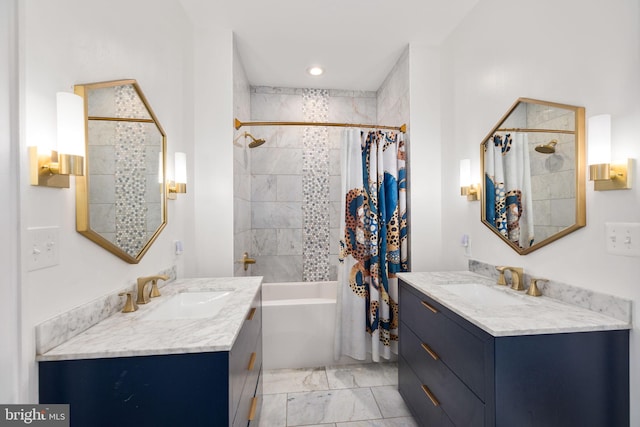 bathroom featuring two vanities, shower / bathtub combination with curtain, marble finish floor, and a sink