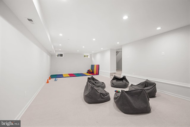 interior space featuring visible vents, baseboards, recessed lighting, and carpet flooring