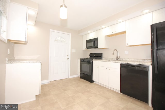 415 Sheppard Ave, Runnemede, NJ 08078 - kitchen featuring black appliances, a sink, white cabinetry, light stone countertops, and hanging light fixtures