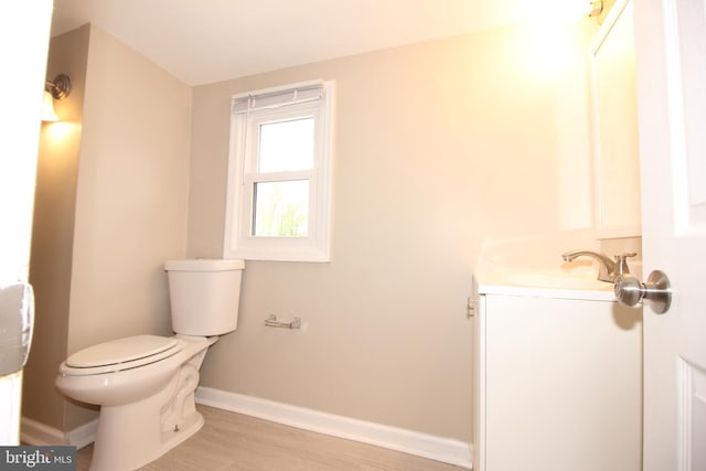 415 Sheppard Ave, Runnemede, NJ 08078 - half bath featuring toilet, vanity, wood finished floors, and baseboards