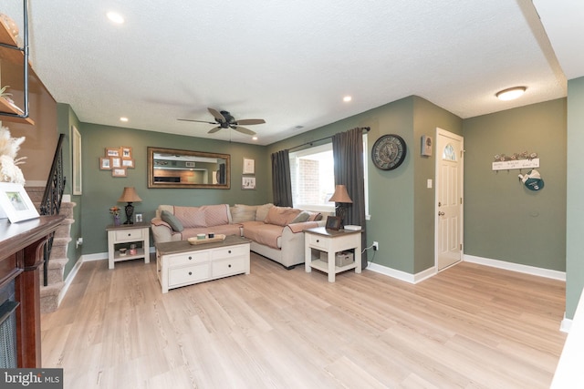 197 Crocus Ct, Quakertown, PA 18951 - living room featuring a ceiling fan, a fireplace, recessed lighting, and light wood-style flooring