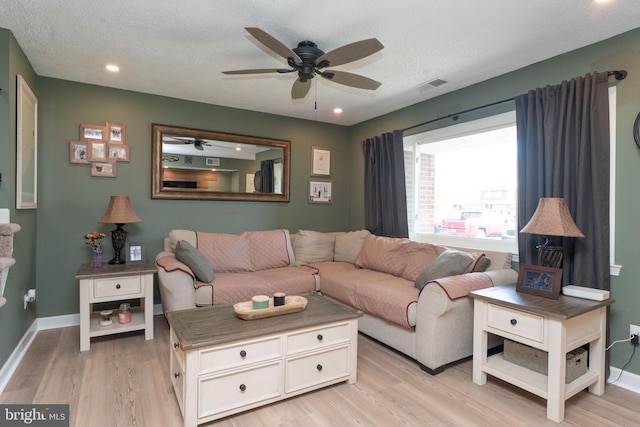 197 Crocus Ct, Quakertown, PA 18951 - living area featuring light wood finished floors, visible vents, a ceiling fan, and baseboards