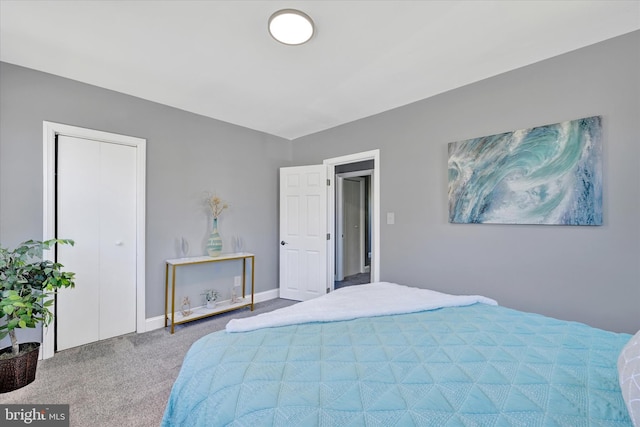 bedroom with carpet flooring and baseboards