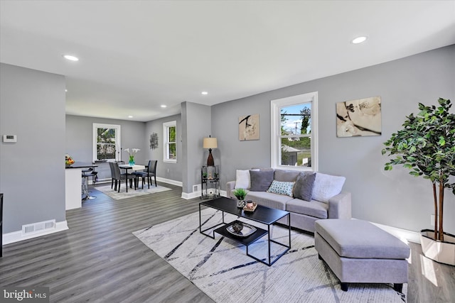 living area featuring a healthy amount of sunlight, recessed lighting, and visible vents