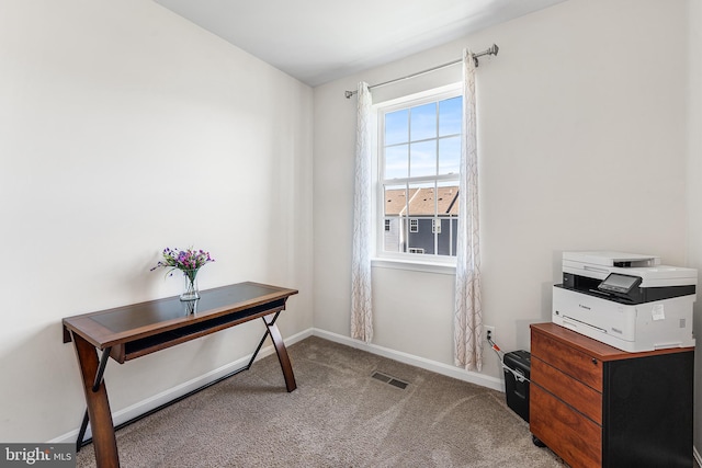 carpeted home office featuring baseboards and visible vents