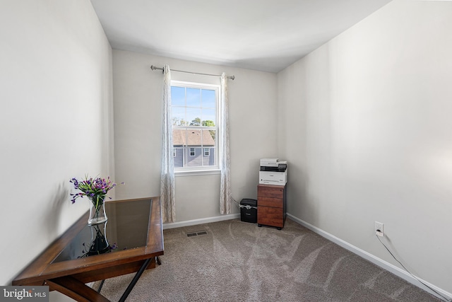misc room with baseboards, visible vents, and carpet