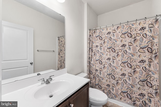 full bath featuring vanity, toilet, and curtained shower