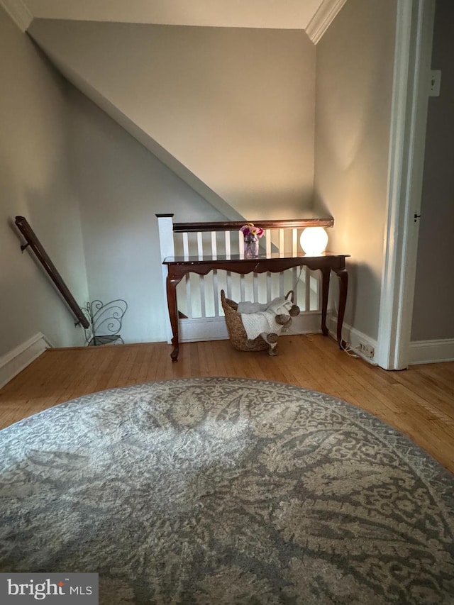interior space with wood finished floors and baseboards