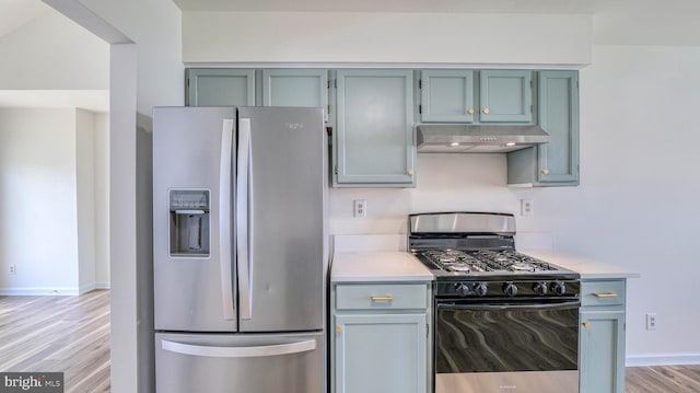 641 Cypress, Vineland, NJ 08360 - kitchen featuring baseboards, light wood-style flooring, under cabinet range hood, and appliances with stainless steel finishes