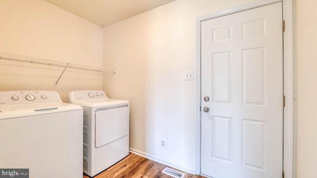 641 Cypress, Vineland, NJ 08360 - laundry room with light wood-style floors, laundry area, baseboards, visible vents, and independent washer and dryer
