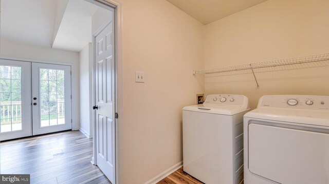 641 Cypress, Vineland, NJ 08360 - laundry area with laundry area, french doors, baseboards, washer and dryer, and light wood-style flooring