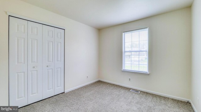 641 Cypress, Vineland, NJ 08360 - unfurnished bedroom featuring baseboards, a closet, visible vents, and carpet