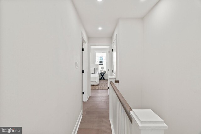 1102 Mercy St, Philadelphia, PA 19148 - corridor featuring baseboards, an upstairs landing, light wood finished floors, and recessed lighting
