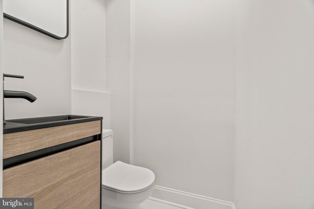 1102 Mercy St, Philadelphia, PA 19148 - half bath featuring baseboards, tile patterned flooring, vanity, and toilet