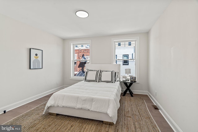 1102 Mercy St, Philadelphia, PA 19148 - bedroom featuring baseboards, visible vents, and dark wood-style floors