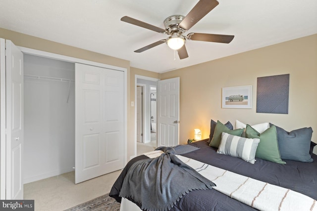 bedroom featuring light carpet, a closet, a ceiling fan, and baseboards