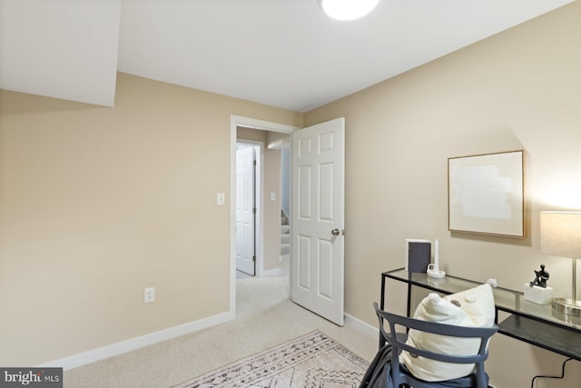 office featuring light colored carpet and baseboards