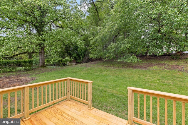 wooden terrace with a yard