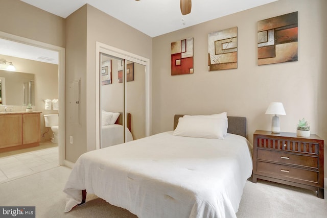 888 N Quincy St Unit 407, Arlington, VA 22203 - bedroom with light colored carpet, a closet, ensuite bathroom, and a ceiling fan