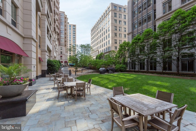 888 N Quincy St Unit 407, Arlington, VA 22203 - view of patio featuring outdoor dining area