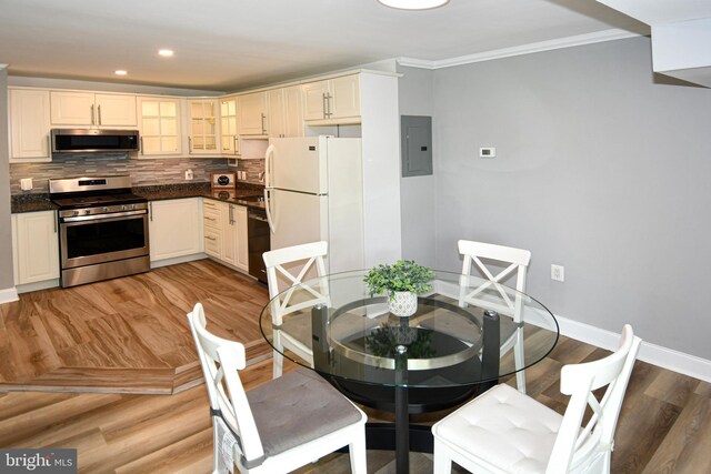 6137 Leesburg Pike Unit 101, Falls Church, VA 22041 - dining area featuring electric panel, ornamental molding, baseboards, light wood-type flooring, and recessed lighting