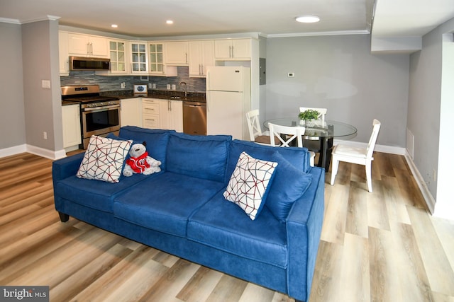 6137 Leesburg Pike Unit 101, Falls Church, VA 22041 - living room with baseboards, ornamental molding, light wood-type flooring, and recessed lighting