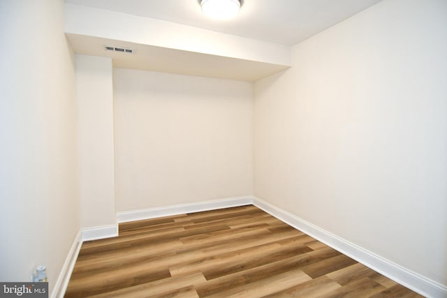 6137 Leesburg Pike Unit 101, Falls Church, VA 22041 - spare room featuring wood finished floors and baseboards