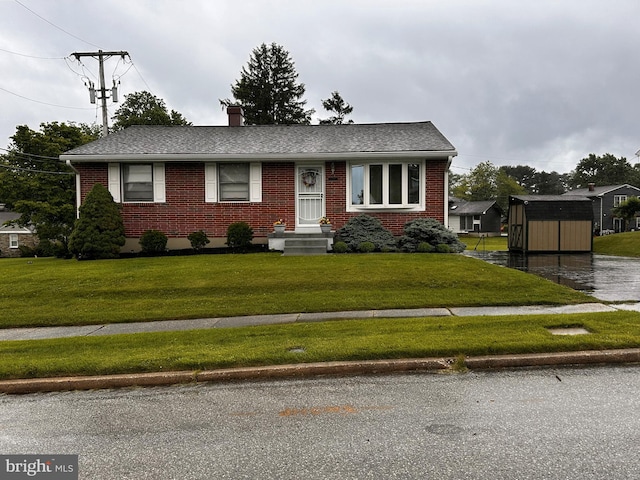 3807 Mcdonogh Rd, Randallstown, MD 21133 - view of front of home featuring brick siding, a front lawn, a chimney, and a shingled roof