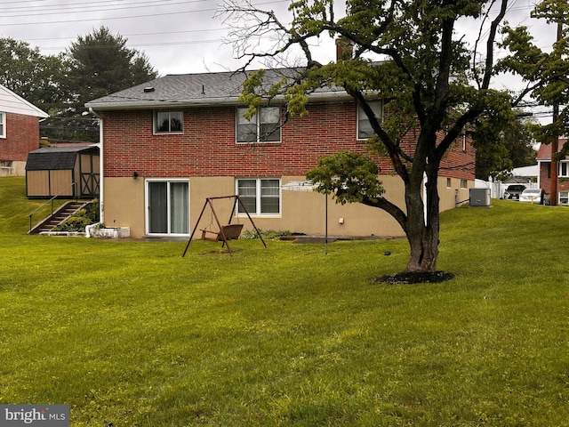 3807 Mcdonogh Rd, Randallstown, MD 21133 - back of house featuring a lawn and brick siding