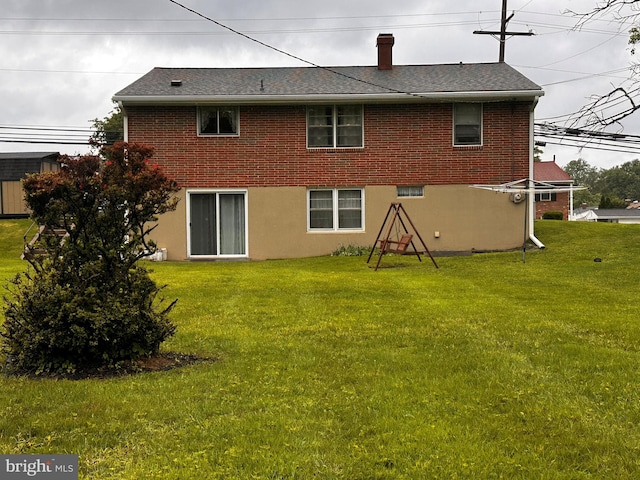 3807 Mcdonogh Rd, Randallstown, MD 21133 - rear view of property featuring a yard, brick siding, and a shingled roof