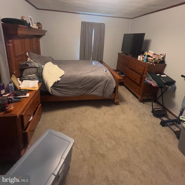 bedroom with light carpet and ornamental molding