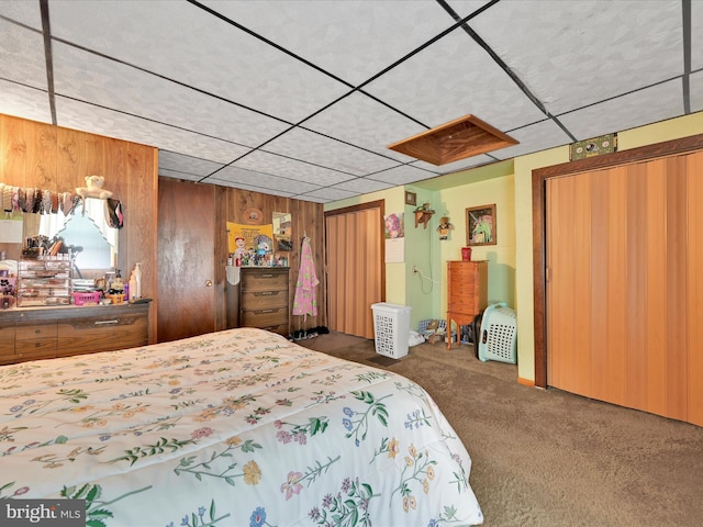 232 N Coal St, Port Carbon, PA 17965 - carpeted bedroom featuring wooden walls and a drop ceiling
