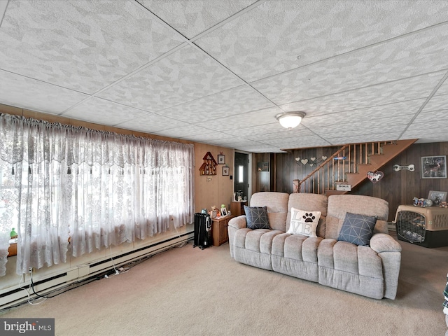 232 N Coal St, Port Carbon, PA 17965 - living area featuring stairway, wooden walls, carpet flooring, and a baseboard heating unit