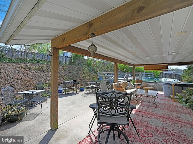 view of patio with an outdoor living space, outdoor dining area, and a fenced backyard