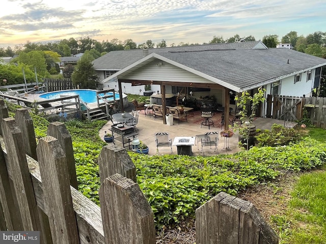 1648-1650 Wampum Dr, Auburn, PA 17922 - back of property featuring roof with shingles, a fenced backyard, and a patio
