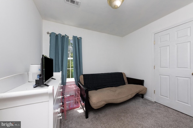 living area with carpet floors and visible vents