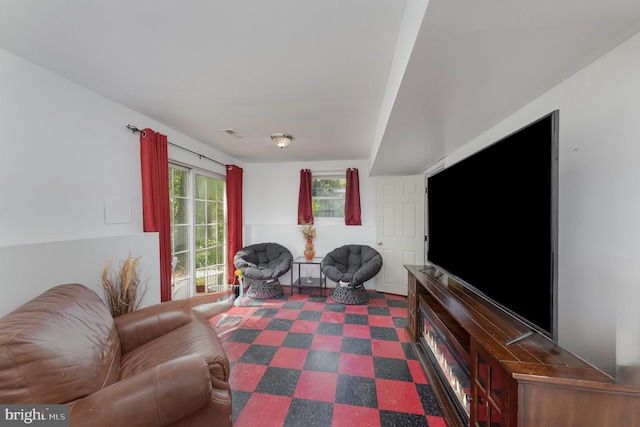 living room featuring visible vents and dark floors