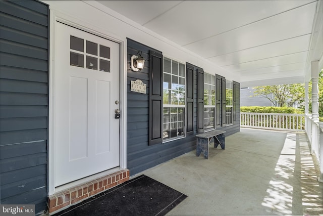 doorway to property with a porch
