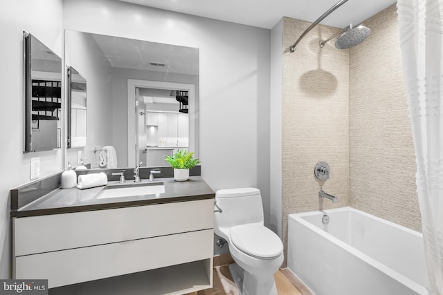 full bath with wood finished floors, vanity, shower / tub combo with curtain, toilet, and visible vents