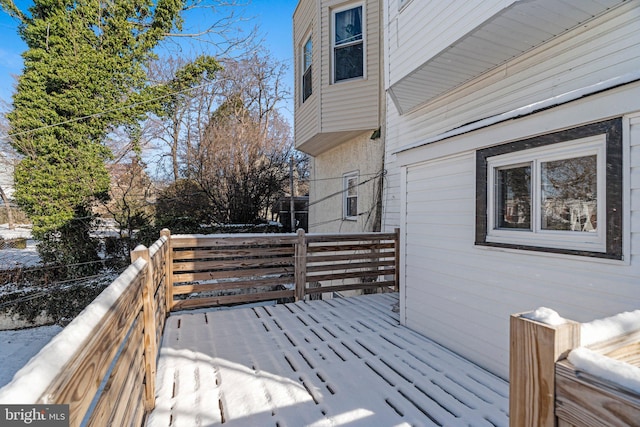 view of snow covered deck