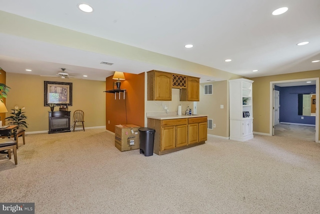 20338 Snowpoint Pl, Ashburn, VA 20147 - kitchen featuring light colored carpet, light countertops, visible vents, and baseboards