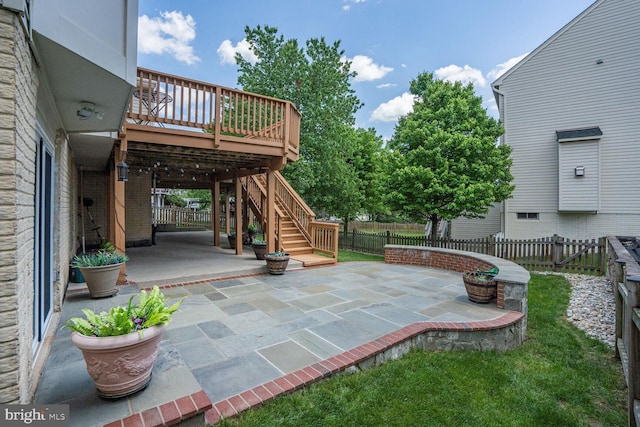 20338 Snowpoint Pl, Ashburn, VA 20147 - view of patio featuring stairway, a deck, and a fenced backyard