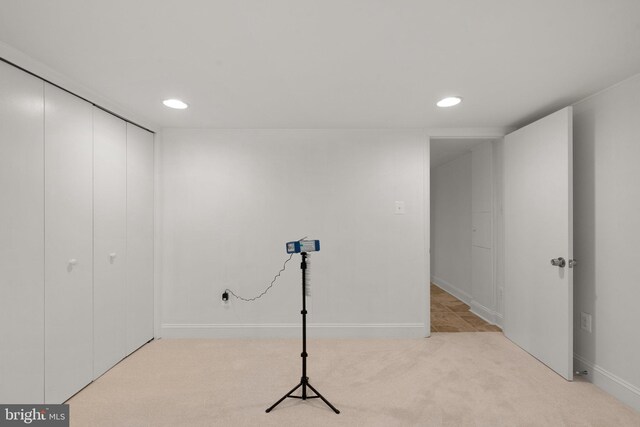 basement featuring recessed lighting, carpet, and baseboards
