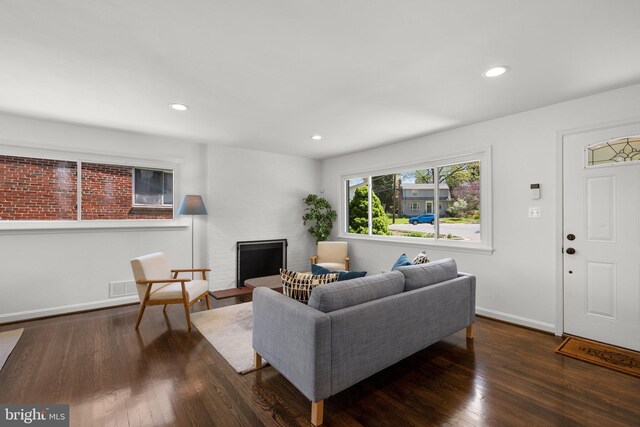 living room with baseboards, recessed lighting, and wood finished floors