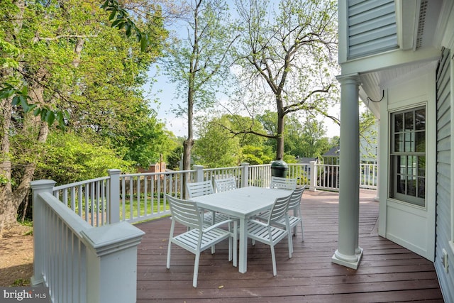 deck featuring outdoor dining area