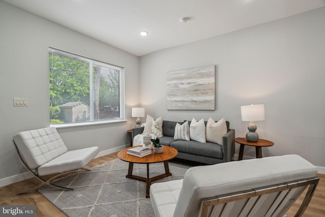 living room with recessed lighting, wood finished floors, and baseboards